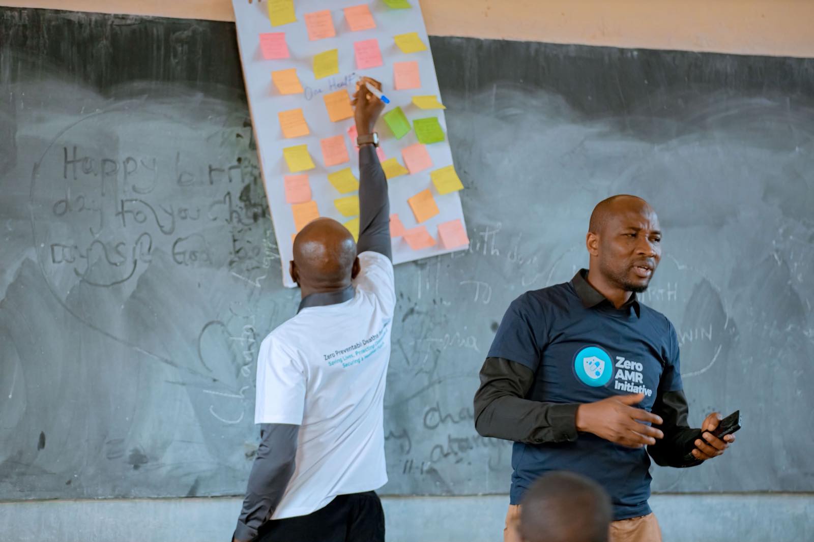 A flip chart covered in coloured sticky notes recording participants' contributions during a workshop